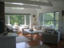 Living room surrounded by windows